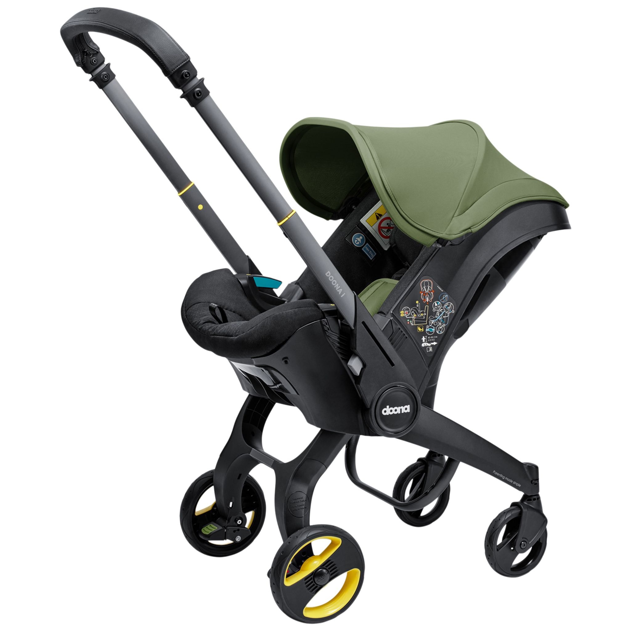 Doona I Babyskydd Och Barnvagn I Ett Desert Green